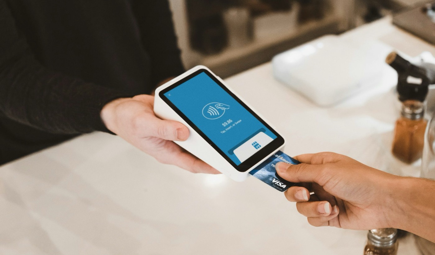 Customer tapping a card on a ShapesPay terminal